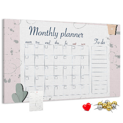 Pizarra de corcho con diseño de agenda mensual y motivos de plantas