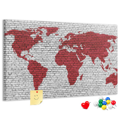 Tablero de corcho decorado Contorno rojo del mundo en una pared de ladrillos