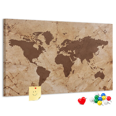Pizarra de corcho con mapa del mundo antiguo sobre fondo marrón