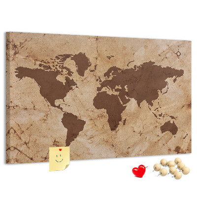 Pizarra de corcho con mapa del mundo antiguo sobre fondo marrón
