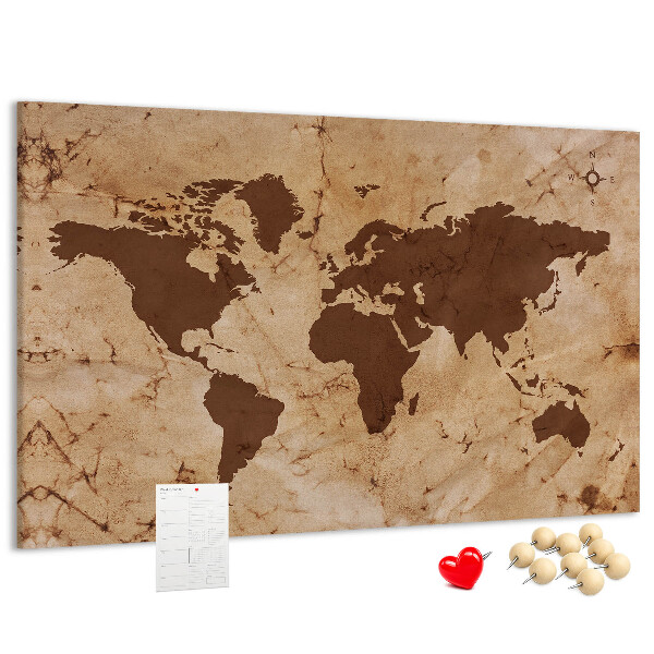 Pizarra de corcho con mapa del mundo antiguo sobre fondo marrón