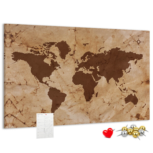 Pizarra de corcho con mapa del mundo antiguo sobre fondo marrón