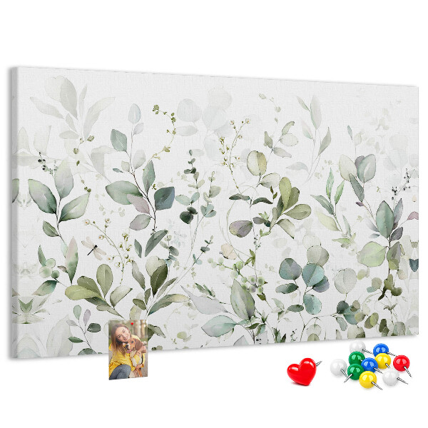 Tablero de corcho decorado con diseño de hojas delicadas en tonos apagados