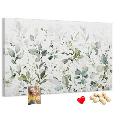 Tablero de corcho decorado con diseño de hojas delicadas en tonos apagados