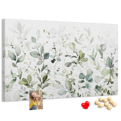 Tablero de corcho decorado con diseño de hojas delicadas en tonos apagados