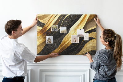 Tablero de anuncios con diseño de ondas de tela doradas y negras