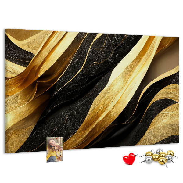 Tablero de anuncios con diseño de ondas de tela doradas y negras