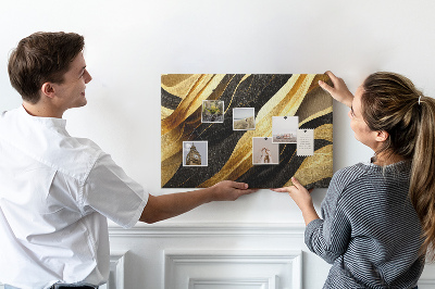 Tablero de anuncios con diseño de ondas de tela doradas y negras