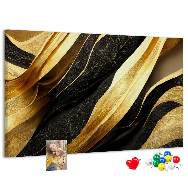 Tablero de anuncios con diseño de ondas de tela doradas y negras