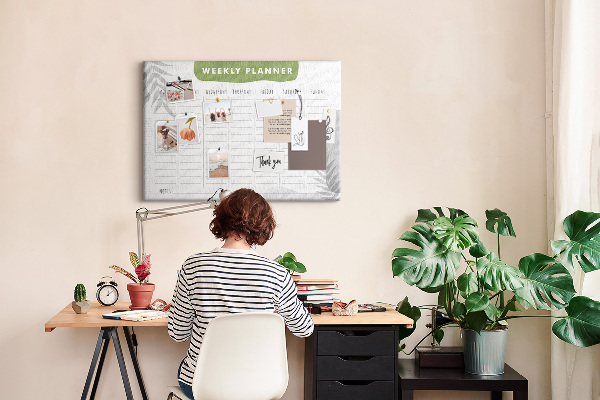 Pizarra de corcho con diseño de agenda semanal y motivos vegetales
