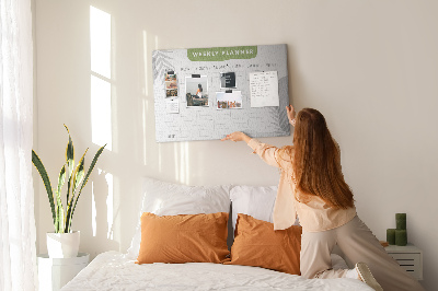 Pizarra de corcho con diseño de agenda semanal y motivos vegetales
