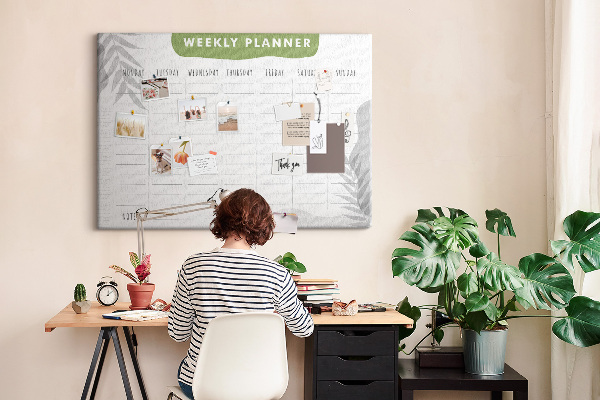 Pizarra de corcho con diseño de agenda semanal y motivos vegetales