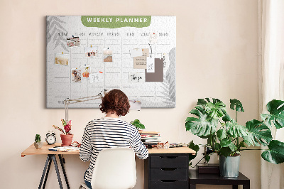 Pizarra de corcho con diseño de agenda semanal y motivos vegetales