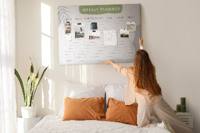 Pizarra de corcho con diseño de agenda semanal y motivos vegetales