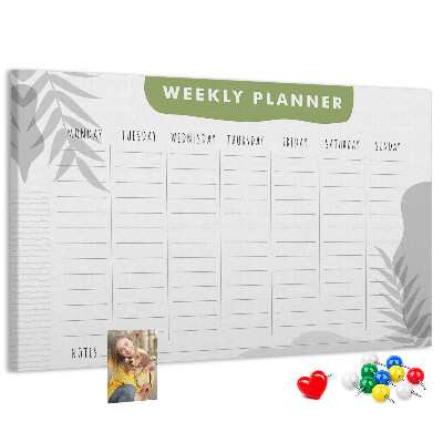 Pizarra de corcho con diseño de agenda semanal y motivos vegetales