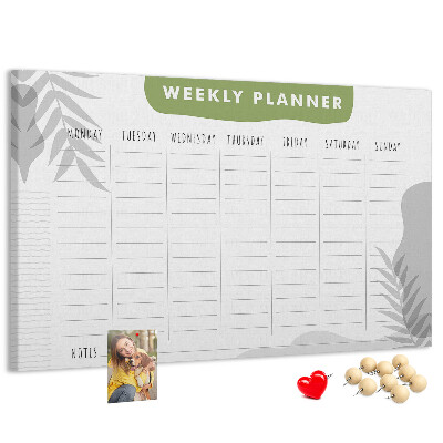 Pizarra de corcho con diseño de agenda semanal y motivos vegetales
