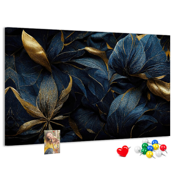 Tablero de corcho decorativo hojas doradas sobre un fondo azul oscuro