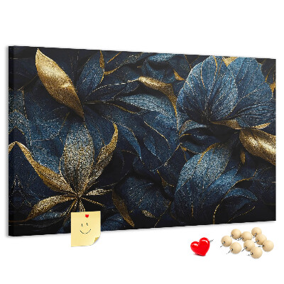 Tablero de corcho decorativo hojas doradas sobre un fondo azul oscuro