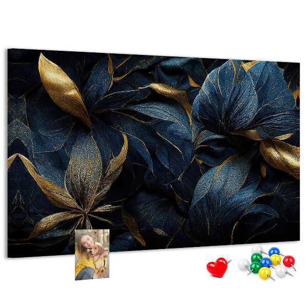 Tablero de corcho decorativo hojas doradas sobre un fondo azul oscuro