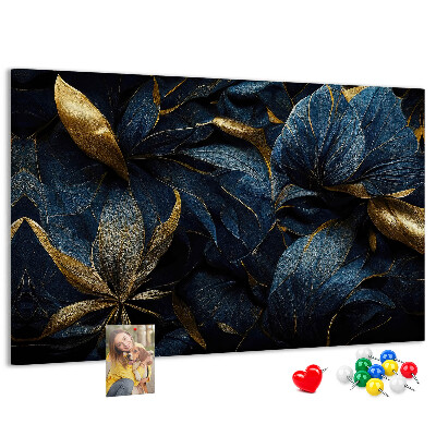 Tablero de corcho decorativo hojas doradas sobre un fondo azul oscuro