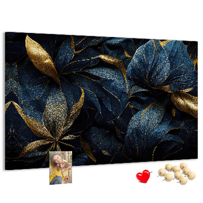 Tablero de corcho decorativo hojas doradas sobre un fondo azul oscuro