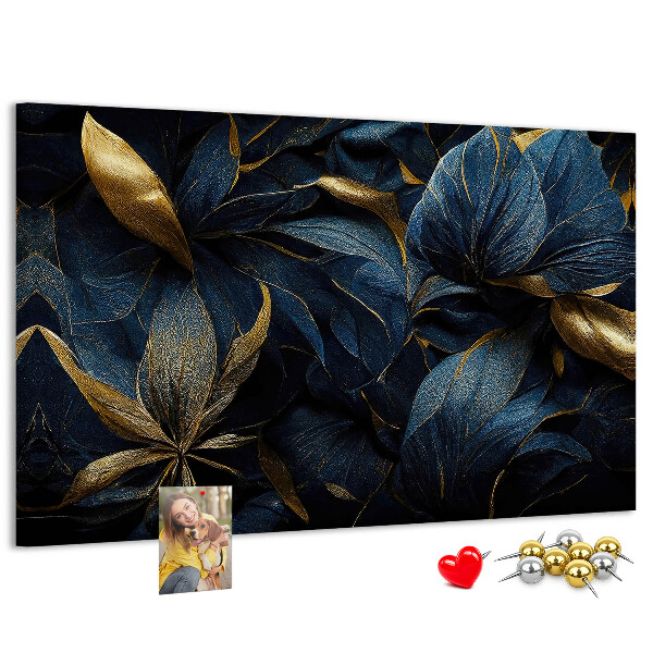Tablero de corcho decorativo hojas doradas sobre un fondo azul oscuro