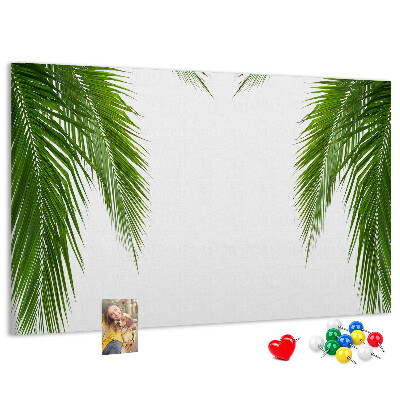 Pizarra de corcho con diseño de hojas de palmera sobre fondo blanco