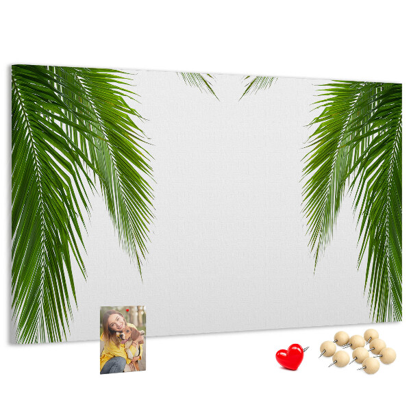 Pizarra de corcho con diseño de hojas de palmera sobre fondo blanco