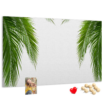Pizarra de corcho con diseño de hojas de palmera sobre fondo blanco