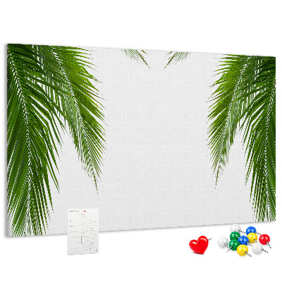Pizarra de corcho con diseño de hojas de palmera sobre fondo blanco