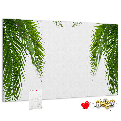 Pizarra de corcho con diseño de hojas de palmera sobre fondo blanco