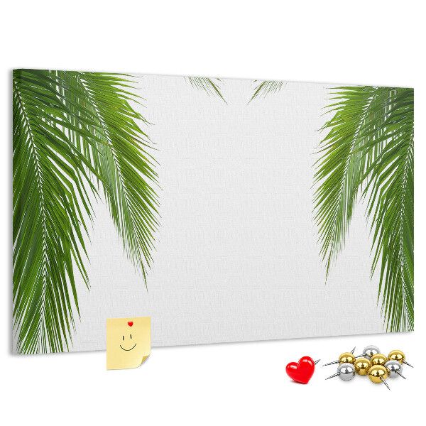 Pizarra de corcho con diseño de hojas de palmera sobre fondo blanco