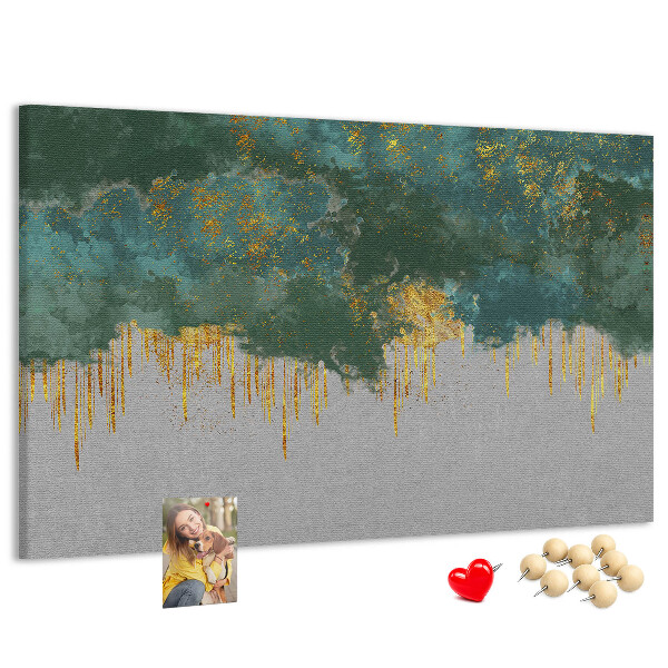 Pizarra de corcho con diseño de gotas doradas sobre fondo de nubes azules