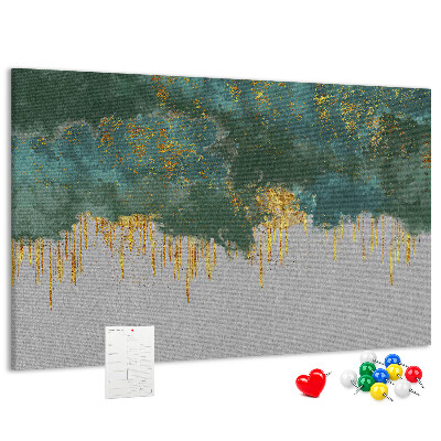 Pizarra de corcho con diseño de gotas doradas sobre fondo de nubes azules
