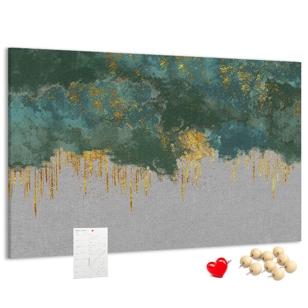 Pizarra de corcho con diseño de gotas doradas sobre fondo de nubes azules