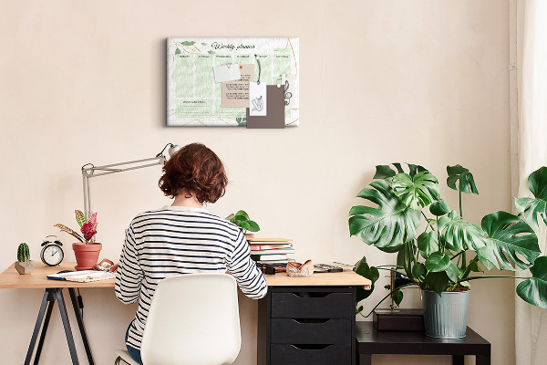 Agenda semanal de color verde con diseño de plantas