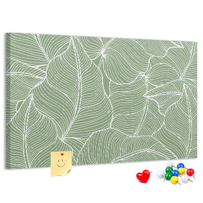 Pizarra de corcho con diseño de hojas y líneas delicadas