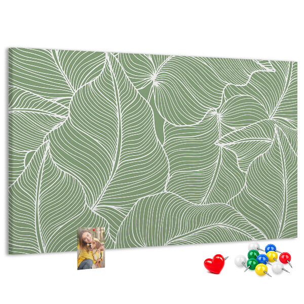 Pizarra de corcho con diseño de hojas y líneas delicadas