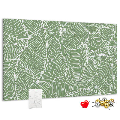 Pizarra de corcho con diseño de hojas y líneas delicadas
