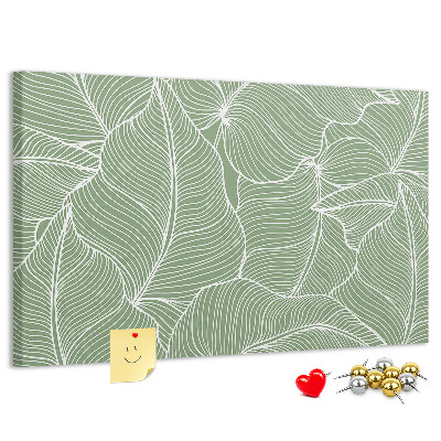 Pizarra de corcho con diseño de hojas y líneas delicadas