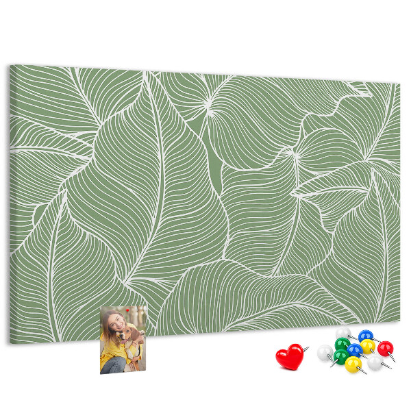 Pizarra de corcho con diseño de hojas y líneas delicadas
