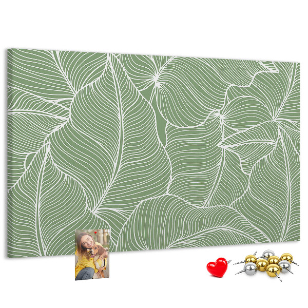 Pizarra de corcho con diseño de hojas y líneas delicadas