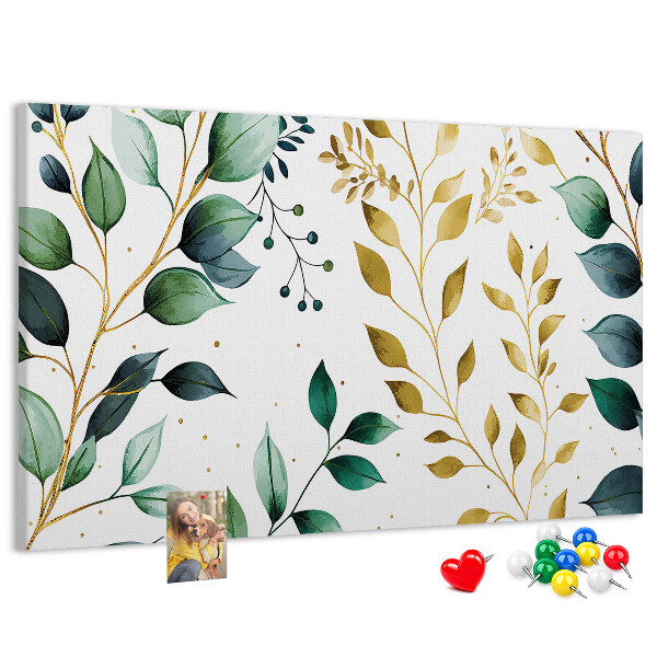 Tablero de corcho decorativo con diseño de hojas doradas sobre fondo claro