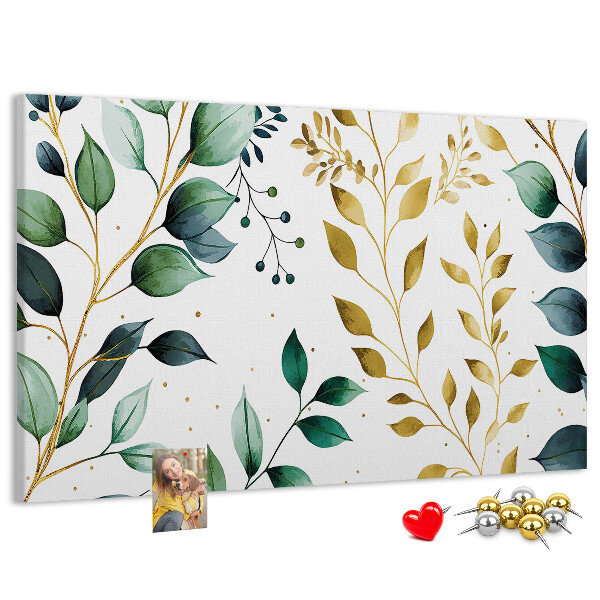 Tablero de corcho decorativo con diseño de hojas doradas sobre fondo claro