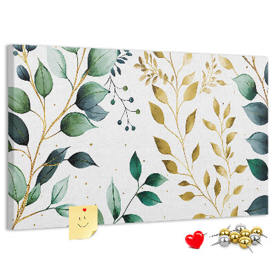 Tablero de corcho decorativo con diseño de hojas doradas sobre fondo claro