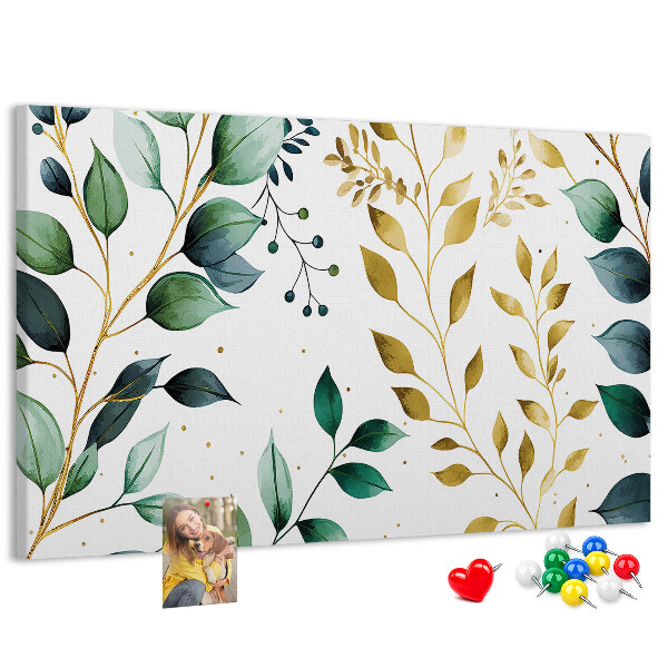 Tablero de corcho decorativo con diseño de hojas doradas sobre fondo claro