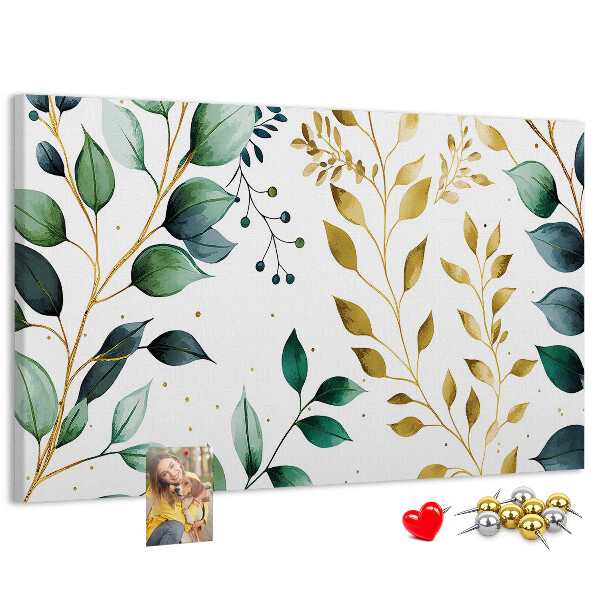 Tablero de corcho decorativo con diseño de hojas doradas sobre fondo claro