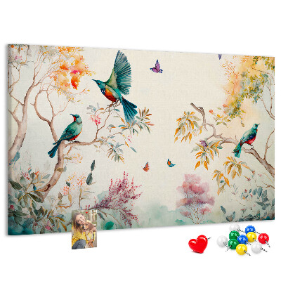 Pizarra de corcho con diseño de pájaros coloridos en un paisaje primaveral