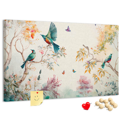 Pizarra de corcho con diseño de pájaros coloridos en un paisaje primaveral