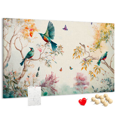 Pizarra de corcho con diseño de pájaros coloridos en un paisaje primaveral